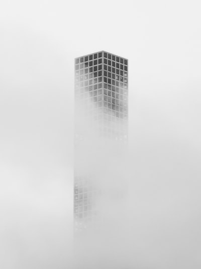 White sky grey concrete building
